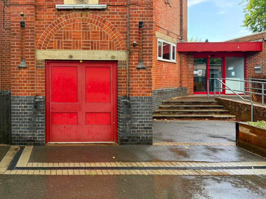 Enter by the glass door