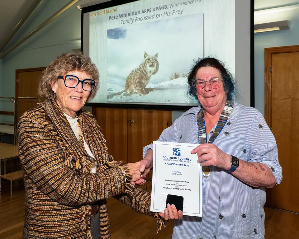 Sandie Cox presents Pete Whieldon's certificate